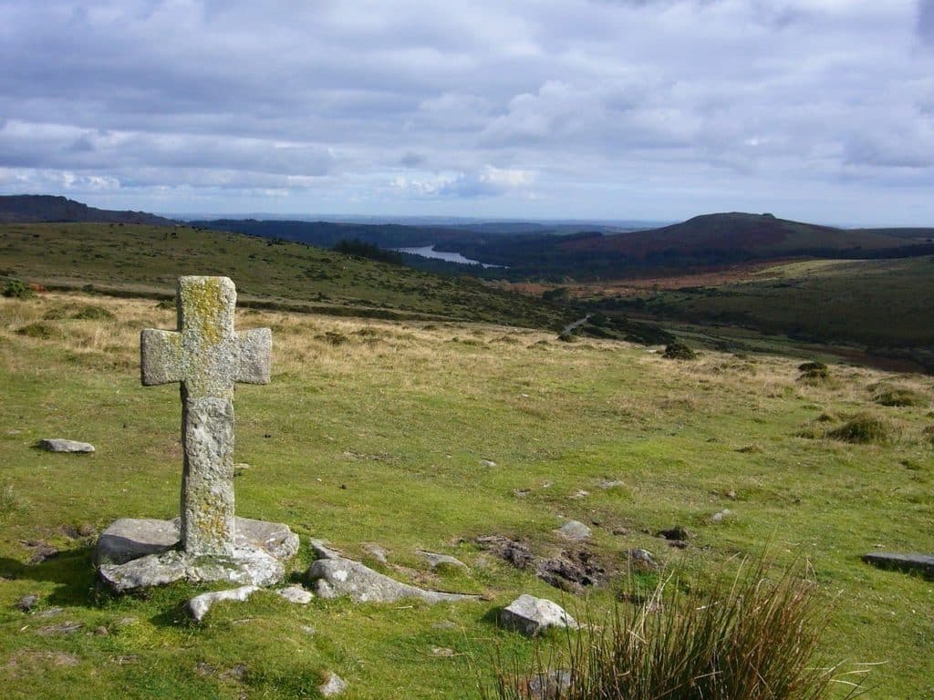 Old stone cross standing on open Irish moorland